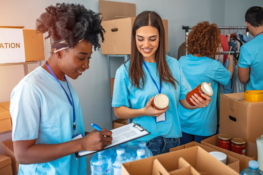 Volunteers sorting donated goods and checking inventory